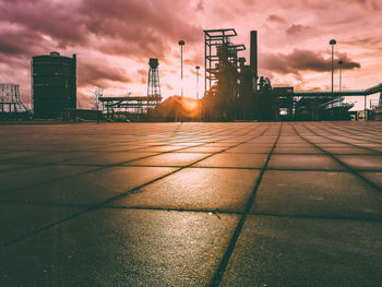 View of factory against cloudy sky