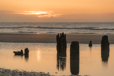 Scenic view of sea against sky during sunrise