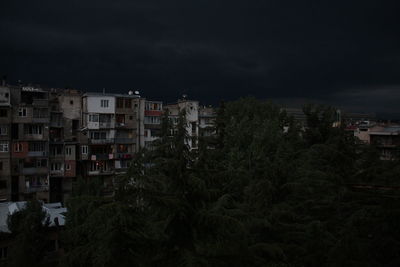 High angle view of buildings against sky at night