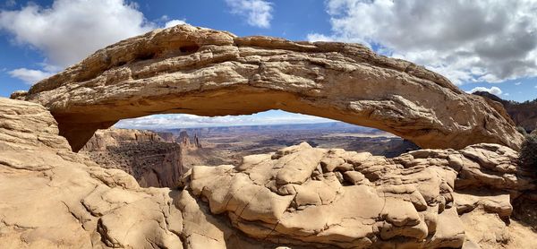 Low angle view of rock formation against sky