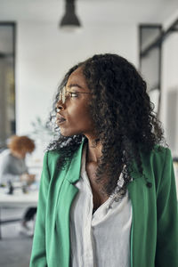 Portrait of a businesswoman in office looking sideways