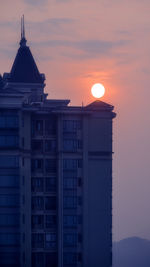 Building against sky during sunset