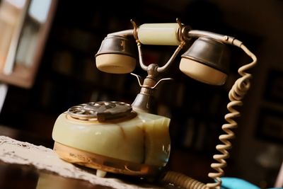 Close-up of old electric lamp on table