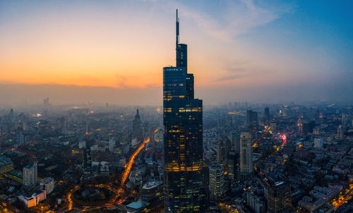 Aerial view of city buildings during sunset