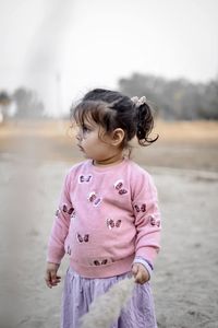 Portrait of cute girl looking away