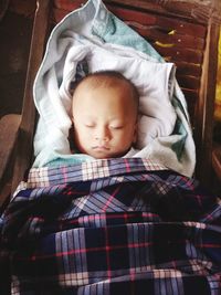 Close-up of baby boy sleeping at home