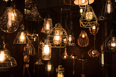 Close-up of illuminated lamp hanging at night