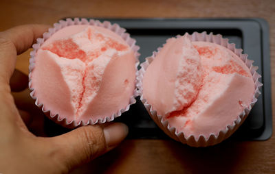 Close-up of hand holding ice cream