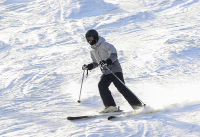 One adult skier enjoying a day on the slope on new years eve 2023.