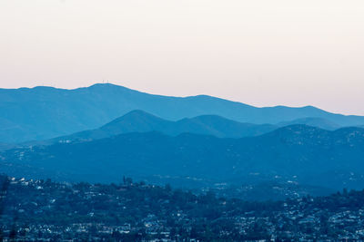 Scenic view of mountains against clear blue sky