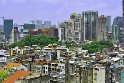 High angle view of buildings in city against sky