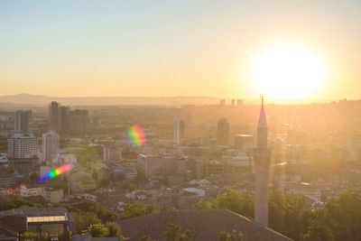 Scenic view of buildings against sky during sunset