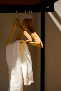 Close-up of clothes hanging on coathanger at store