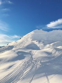 Scenic view of snowcapped mountain against sky