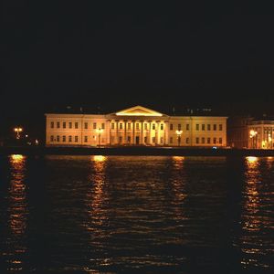 Reflection of buildings in water at night