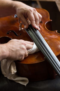 Close-up of hands playing piano