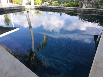 High angle view of reflection of clouds in water