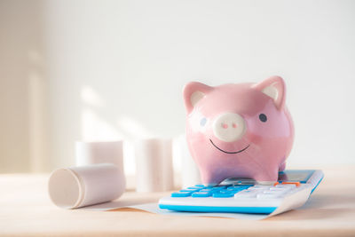 Close-up of piggy bank on table