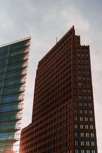 Low angle view of modern buildings against sky