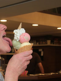 Cropped image of hand holding ice cream