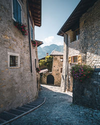 Narrow alley amidst buildings in town