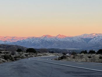 Scenic view of snowcapped mountains against sky during sunset