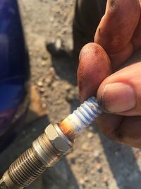Close-up of man holding cigarette