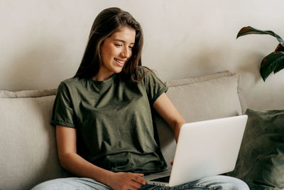 Young woman using laptop