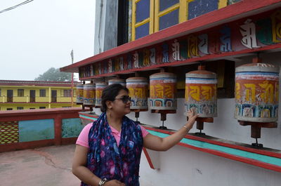 Woman standing at temple