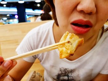 Close-up of girl eating food