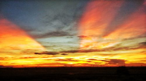 Scenic view of dramatic sky during sunset