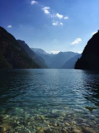 Scenic view of lake and mountains against sky