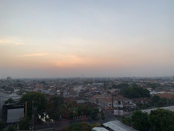 High angle view of townscape against sky during sunset