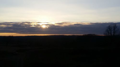 Scenic view of silhouette landscape against sky during sunset