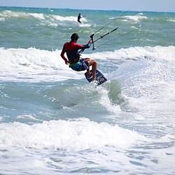 People surfing in sea