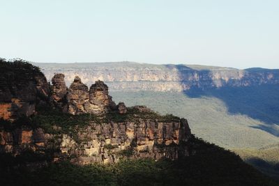 Rock formations on landscape against sky