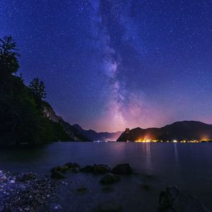 Scenic view of mountains against sky at night