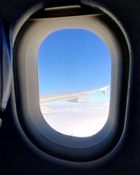 View of airplane wing seen through window