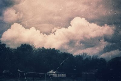 Cloudy sky over trees