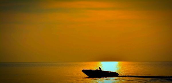 Scenic view of sea at sunset