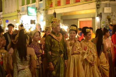 Group of people at market stall