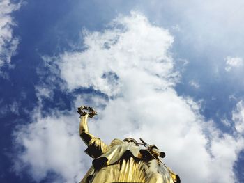 Low angle view of statue against sky