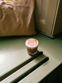 High angle view of coffee cup on table