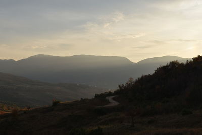 Scenic view of field against sky during sunset