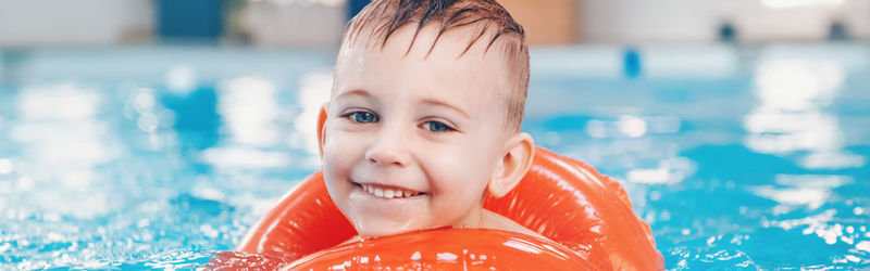 Portrait of smiling boy in swimming pool