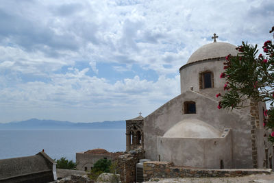 View of bell tower against cloudy sky