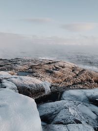 Scenic view of sea against sky during winter