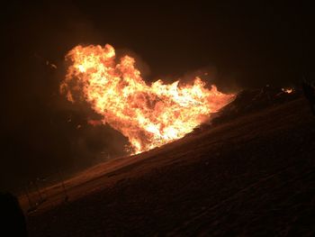 View of bonfire at night