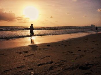 Scenic view of sea at sunset
