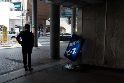 Man in corridor of building